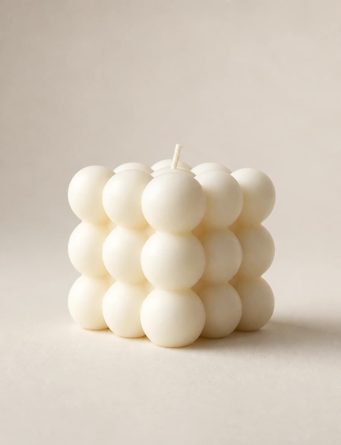 Atelier Grid sculptural bubble candle in a warm studio setting
